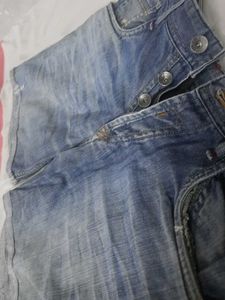 Distressed Blue Denim Jeans