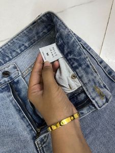 Oversized T-shirt + Light Blue Wide-Leg Jeans