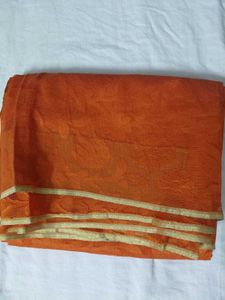 Vibrant Orange Saree with Golden Border
