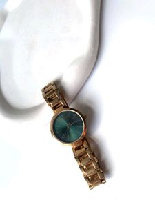 Elegant Gold Watch with Green Dial