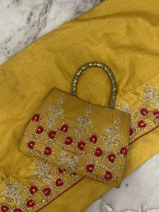 Yellow Saree with Red Blouse &amp; Handbag