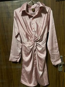 Imported satin finish twist front dress.