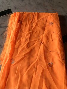 Vibrant Orange Saree with Delicate Floral Motifs