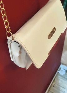 Chic Cream Crossbody Bag with Gold Chain