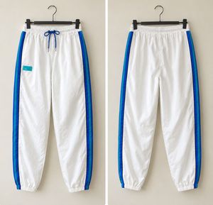 White Track Pants with Blue Stripes