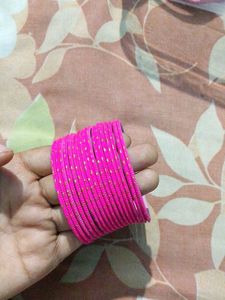 Vibrant Pink Bangles with Gold Accents