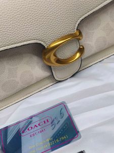 Coach Tabby Off White with c print.