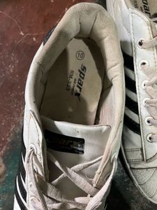 White Sneakers with Black Stripes
