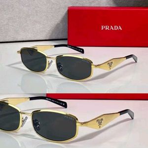 Prada Sunglasses - Gold Frame