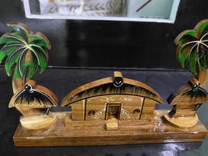 It Is A House With Huts And Trees. It Is Handmade Made With Love And Care.