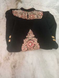 golden and red embroidery black kurti