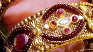 Elegant Gold and Ruby Bangle