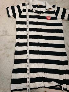 Women's black and white striped polo tee