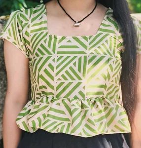 This is a light green crop top.