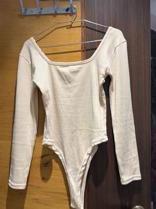 Cream Long Sleeve Bodysuit