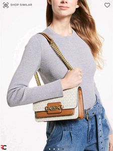 MICHAEL KORS**SIGNATURE LOGO PRINT HEATHER BAG*