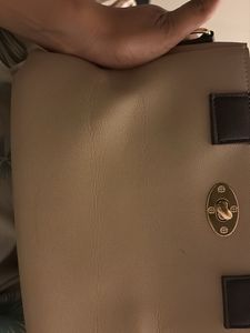 Elegant Beige Handbag with Black Handles