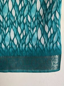 Elegant Teal Saree with Intricate Border