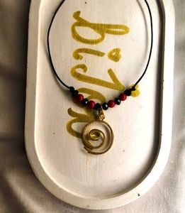 Balck and red beads with golden spiral