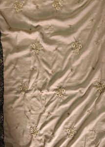 Elegant Beige Embroidered Saree