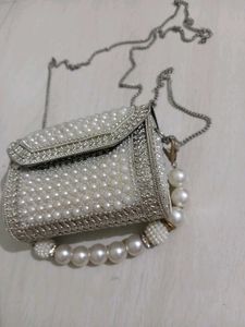 Elegant Pearl Embellished Clutch from Snatcher
