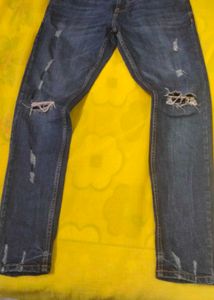 Distressed Blue Denim Jeans