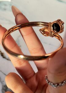 Elegant Gold Tone Bracelet with Black Stone