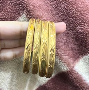 Gold-toned Bangle Set (4) 2-4
