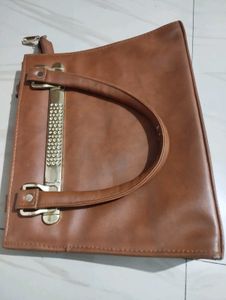 Chic Brown Handbag with Embellished Handle
