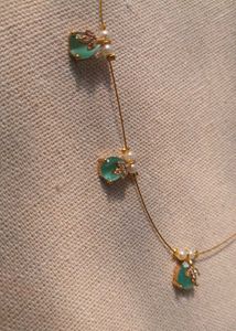 Elegant Gold Necklace with Gemstone Details