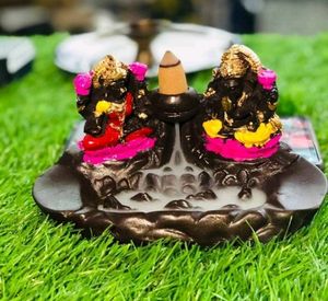 Smoke Ganesh and Laxmi Foundation with sticks