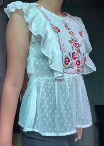 Embroidered White Peplum Top