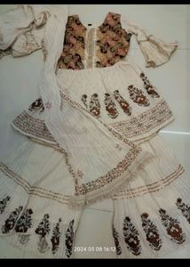 cream colour gharara and top with dupatta