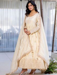 White Anarkali suit with golden embriodery