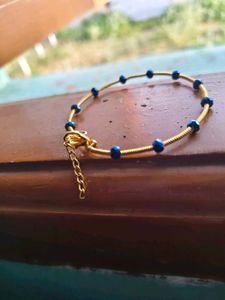 Gold Tone Bracelet with Blue Beads