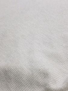 White asymmetrical sweater