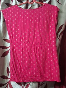 a pink short kurti