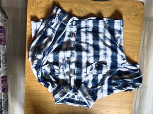 Blue Plaid Button-Up Shirt with ruffled sleeves.
