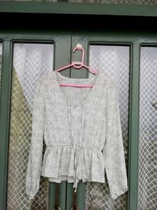 Chic Printed Peplum Blouse with Tie Neck