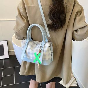 Chic Pink Plaid Handbag with Charm