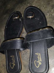 Stylish Black Flat Sandals with Gold Accent