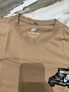 last price Nike Tan Graphic Tee