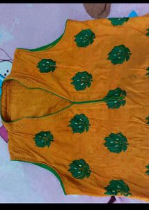 Orange Kurti with Green Leaf Print