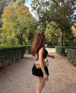 Sleek Black Mini Dress with Ruffle Skirt
