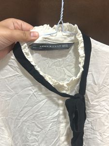 Elegant White Top with Black Ribbon