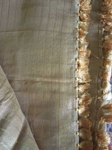 Elegant Gold Striped Fabric with Tassel Trim