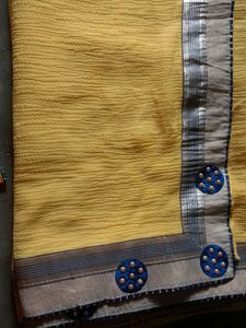 Vibrant Yellow Saree with Blue Embellishments