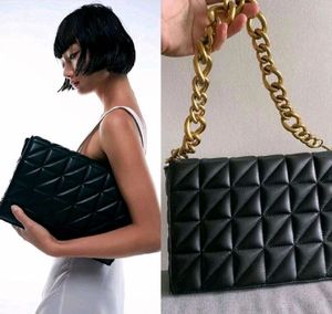 Chic Quilted Black Handbag with Gold Chain
