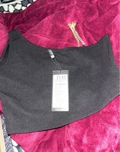 Chic Black One-Shoulder Top with Gold Chain