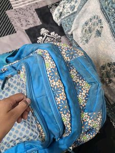 Blue Backpack with Floral Pattern